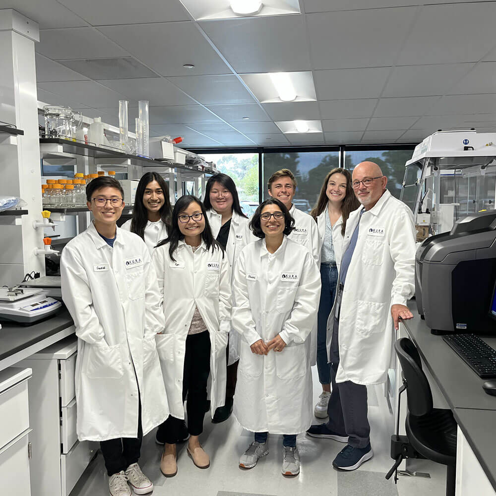 Scientist group photo in a lab